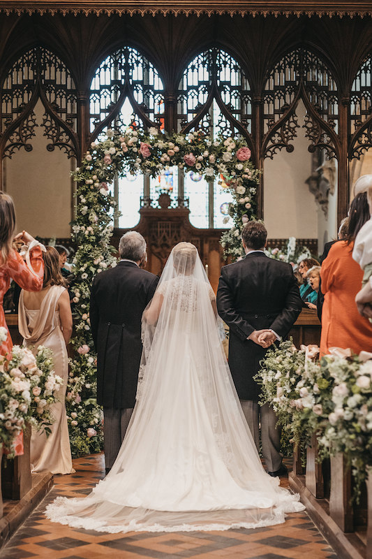 A FLUID SATIN CHIFFON AND HAND BEADED FRENCH LACE WEDDING DRESS