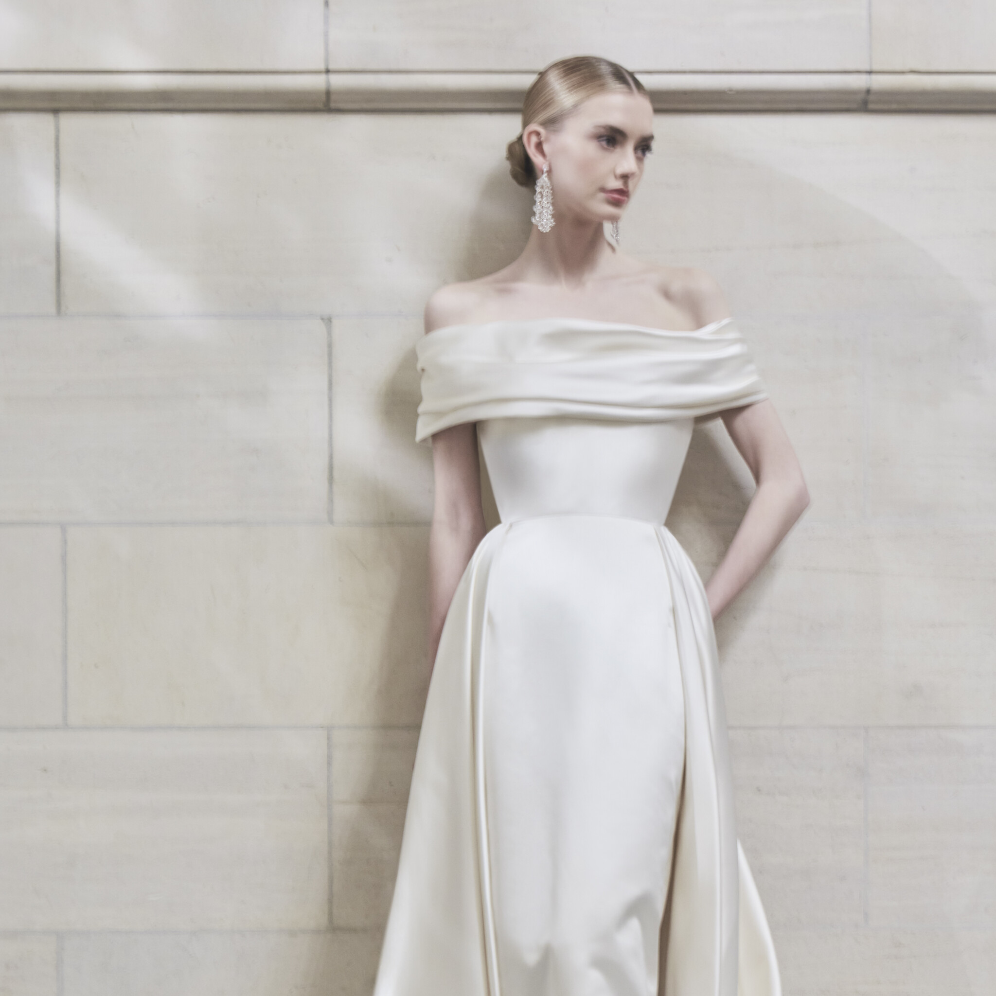 Phillipa Lepley Couture Wedding Dress London San Marino off the shoulder collar neckline corseted duchess satin wedding gown with asymmetrical draped neckline and straight skirt with overskirt