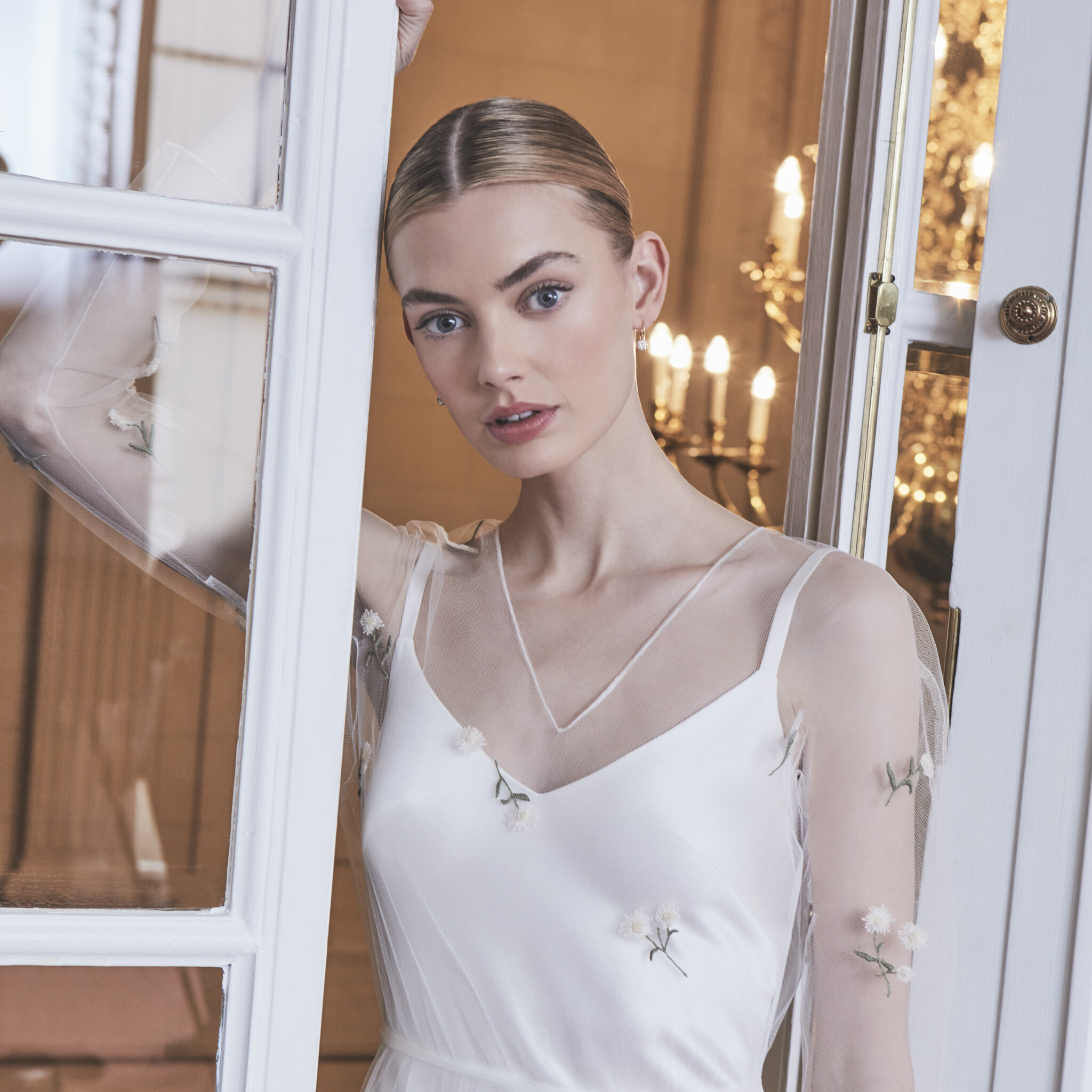 Phillipa Lepley Couture Wedding Dress London Eton Slip Dress With Cap Ferrat Erigeron tulle Overlay with deep v neckline and long sleeves scattered with embroidered Erigeron