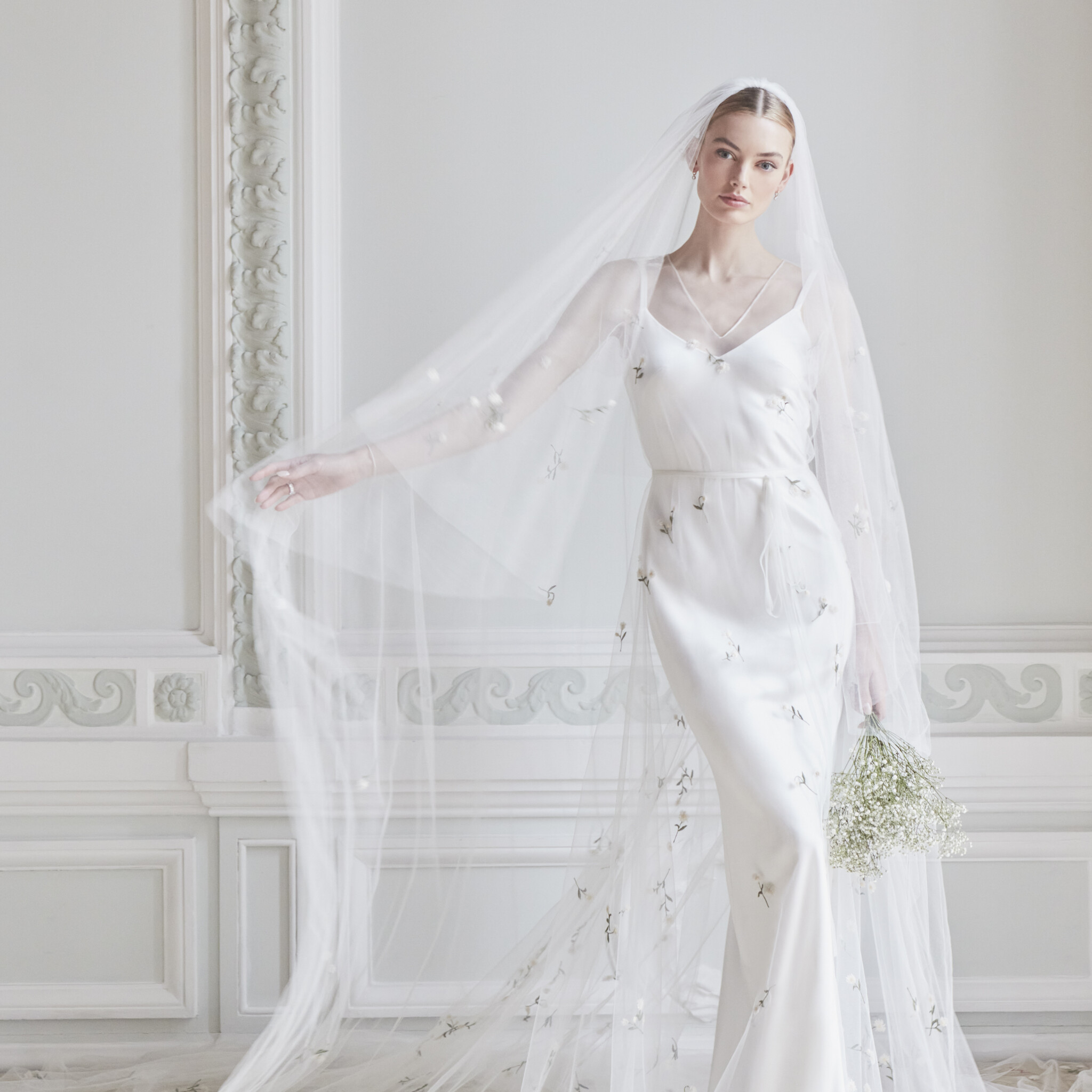 Phillipa Lepley Couture Wedding Dress London Eton Slip Dress With Cap Ferrat Erigeron tulle Overlay with deep v neckline and long sleeves scattered with embroidered Erigeron with hand embroidered Erigeron Veil