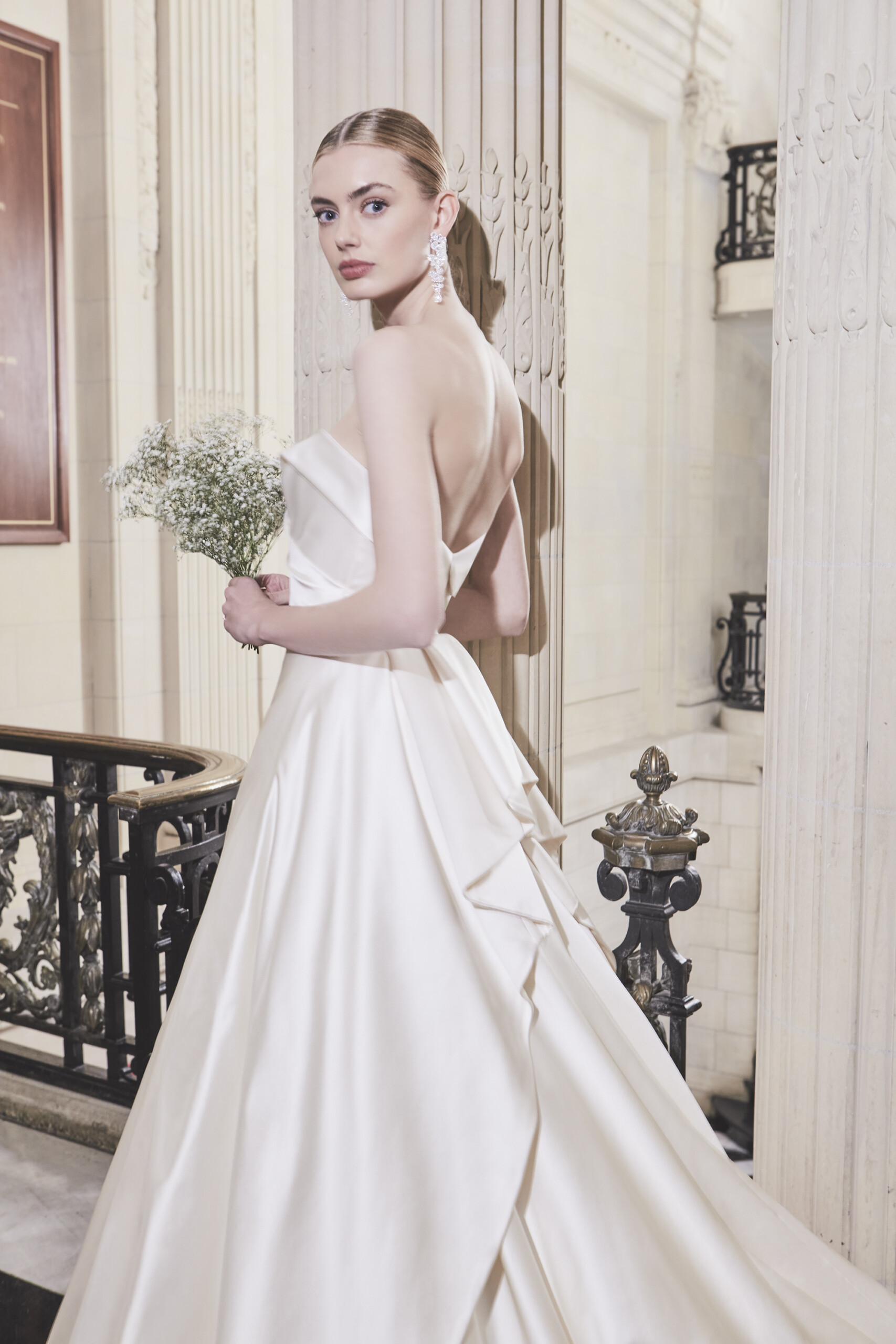 Phillipa Lepley Couture Wedding Dress London Nightingale strapless cross over band neckline duchess satin corseted wedding gown with long train apron style skirt with pleated ruffles at back