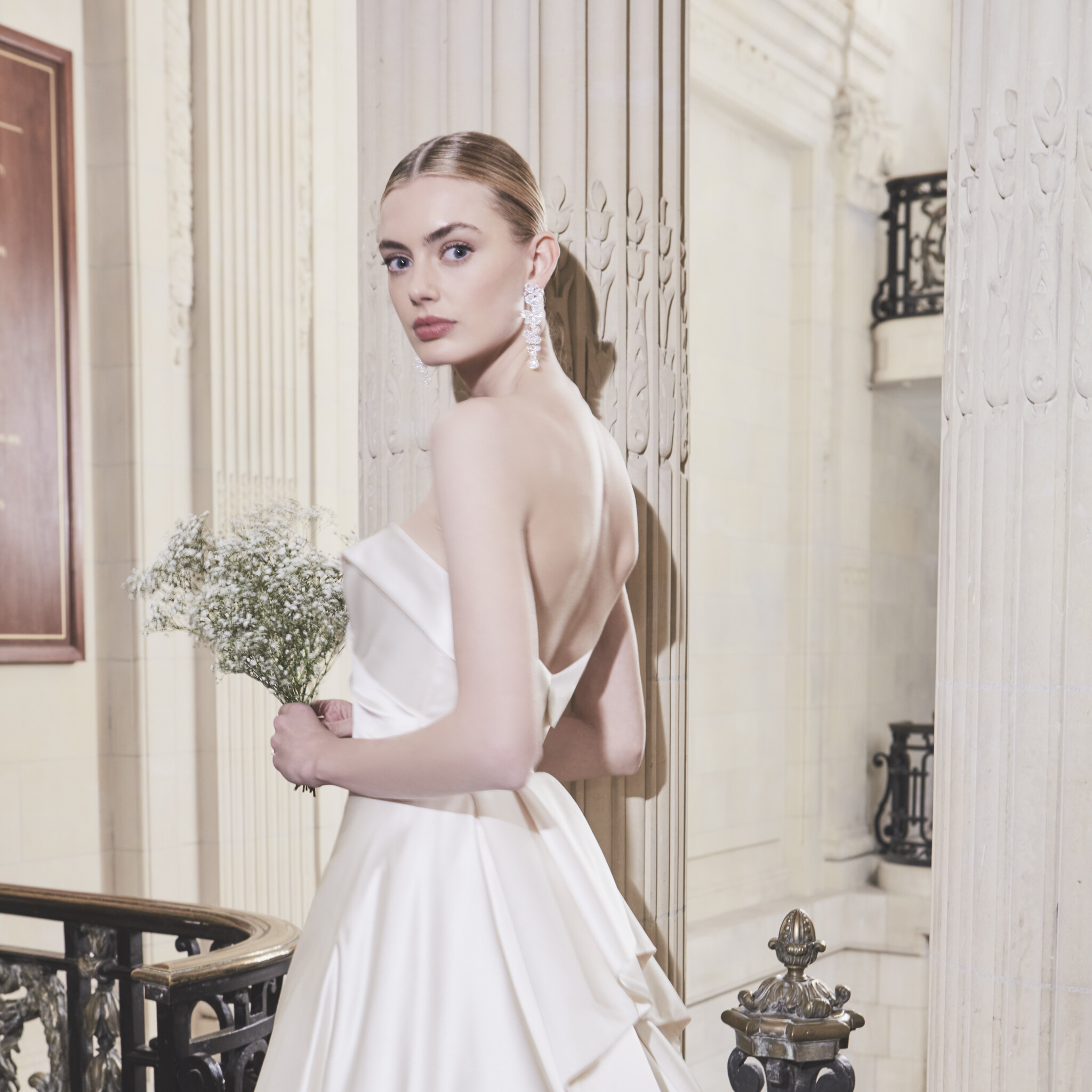 Phillipa Lepley Couture Wedding Dress London Nightingale strapless cross over band neckline duchess satin corseted wedding gown with long train apron style skirt with pleated ruffles at back