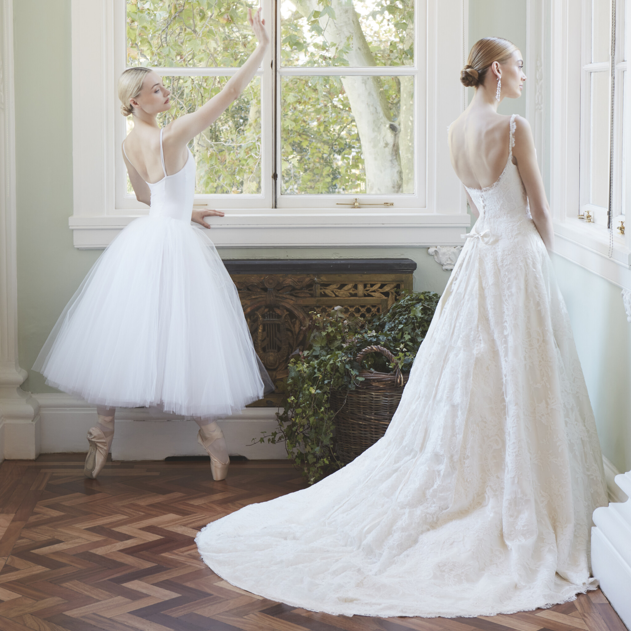 Phillipa Lepley Couture Wedding Dress London Symmetrical Scroll Tied Back A line wedding gown with silk satin base and symmetrically cut scroll lace overlay apron tie back skirt gathered lace