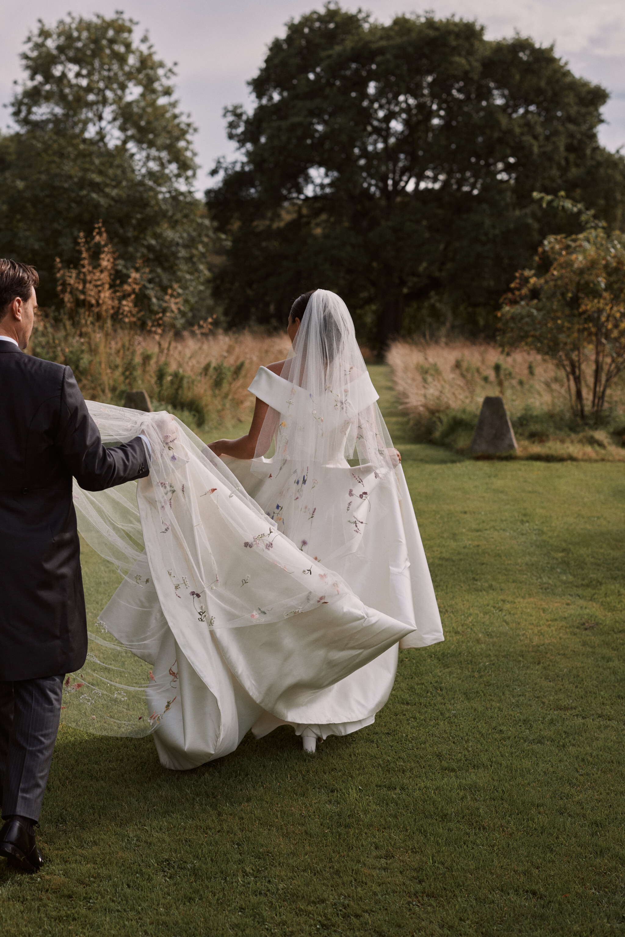 Phillipa Lepley bride Harriet Duchess Satin Off The Shoulder Wedding Dress Colourful Hand Embroidered Wildflower Meadow Veil